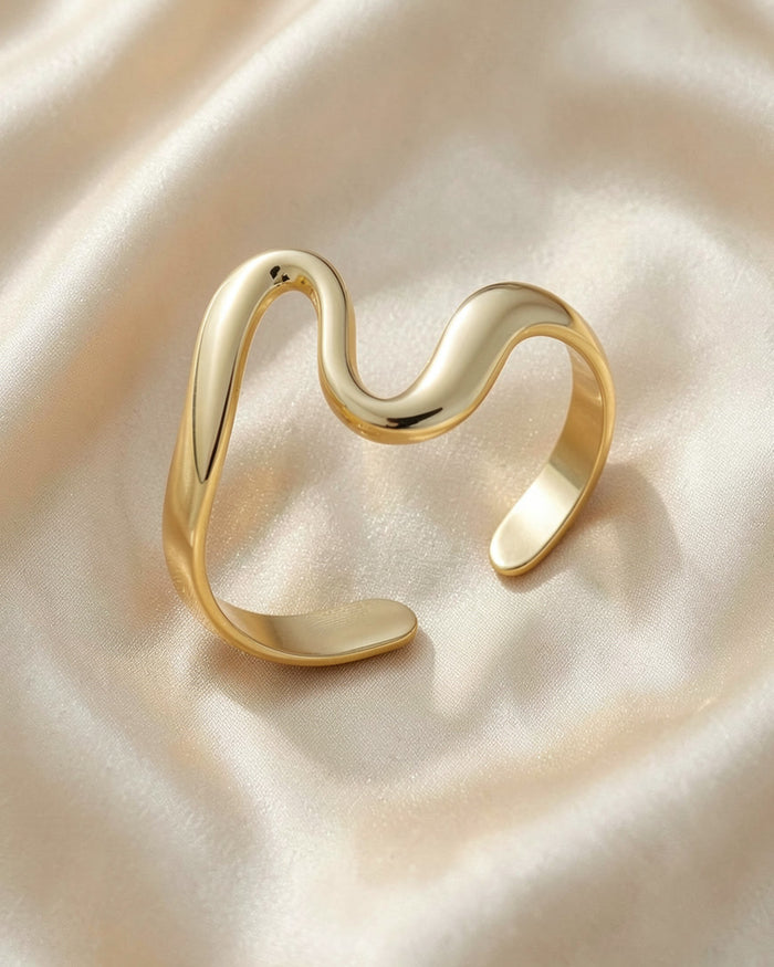The Serpent ring in gold tone on ivory silk