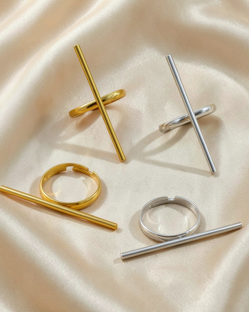 The Line bar ring in gold and steel, crossed bar and side bar, on silk